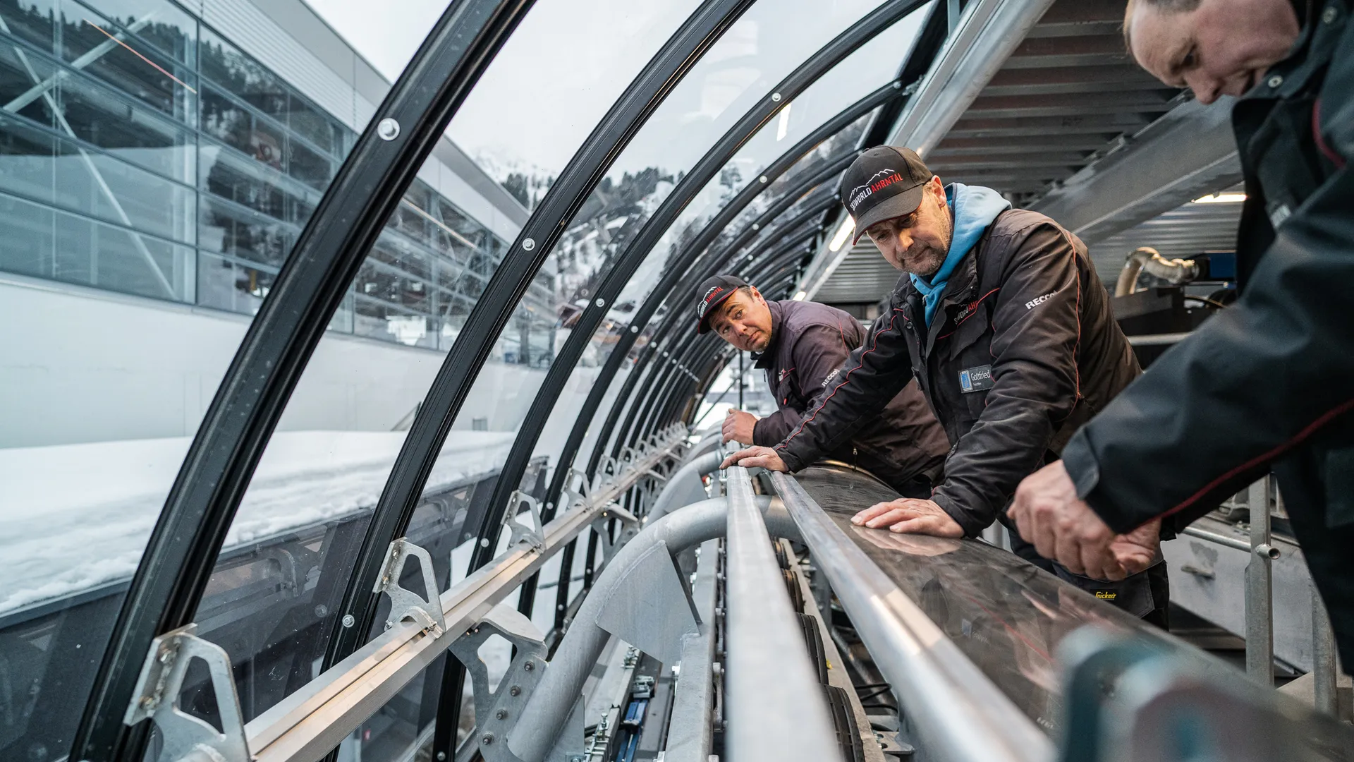 Technician performing maintenance work on the cable car of Skiworld Ahrntal