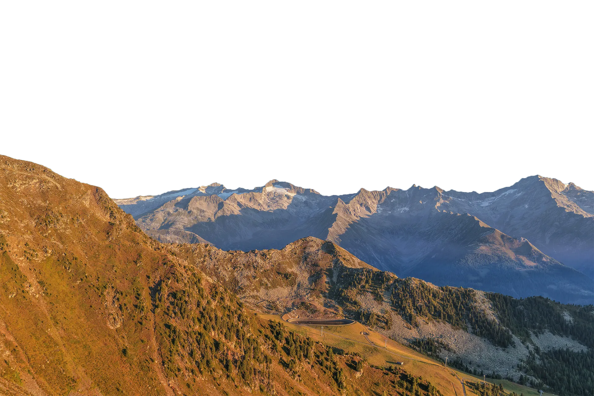 Alpine panorama at Speikboden at sunset with reservoir and ski resort infrastructure