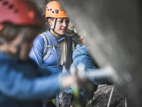 Children's via ferrata tour at Speikboden — guide explaining climbing technique