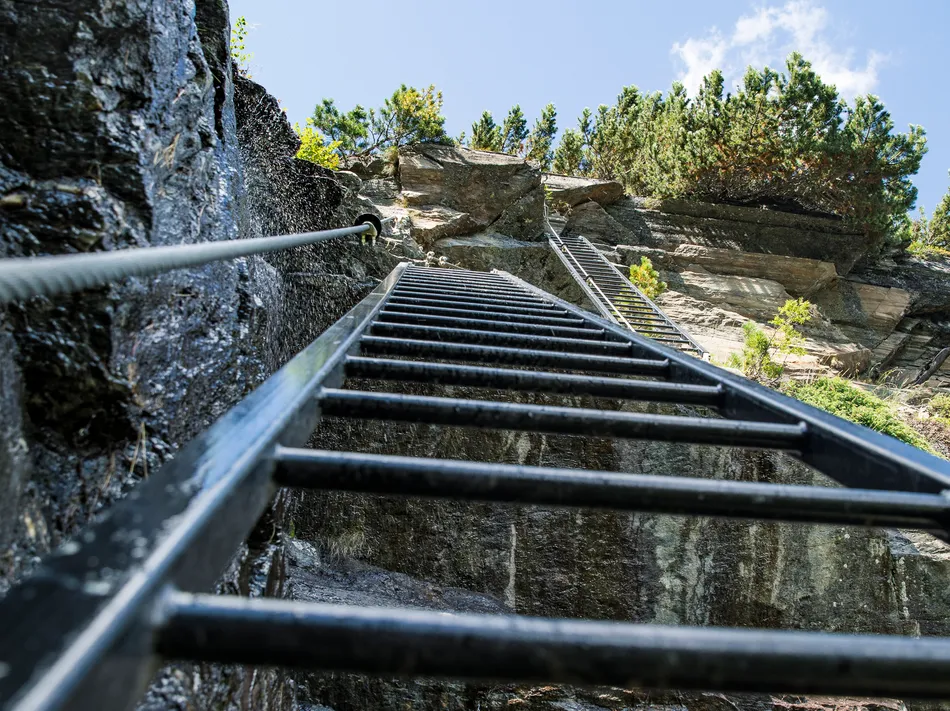 Vertical iron ladder on Speikboden via ferrata route in summer